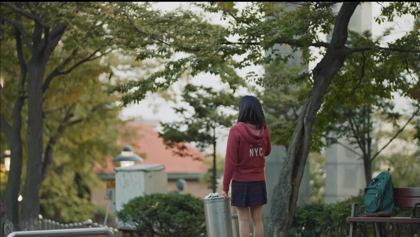 Eun-tak in red sweater walking through Jayu Park