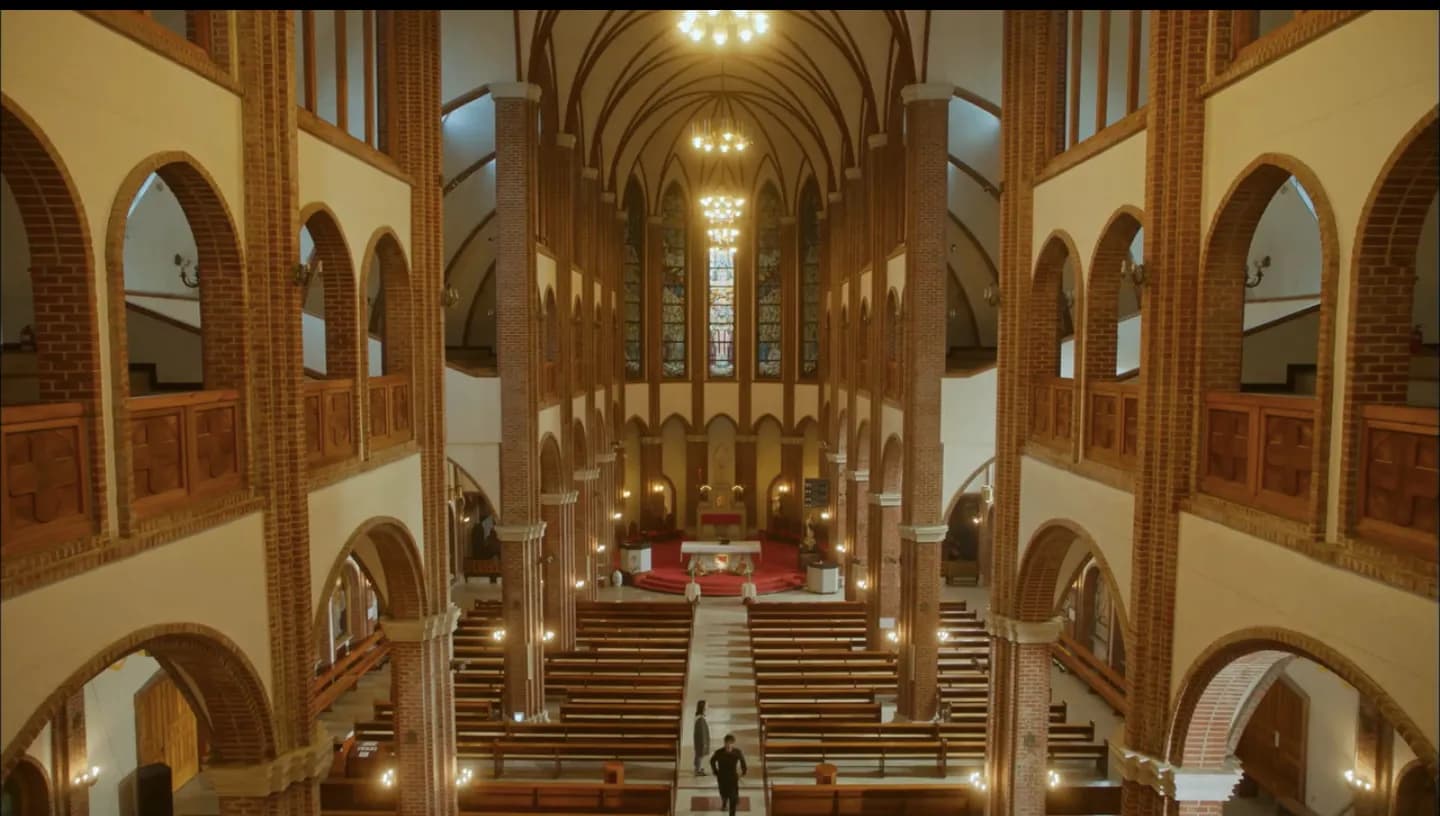 Interior of Mirinae basilica with arches and chandeliers