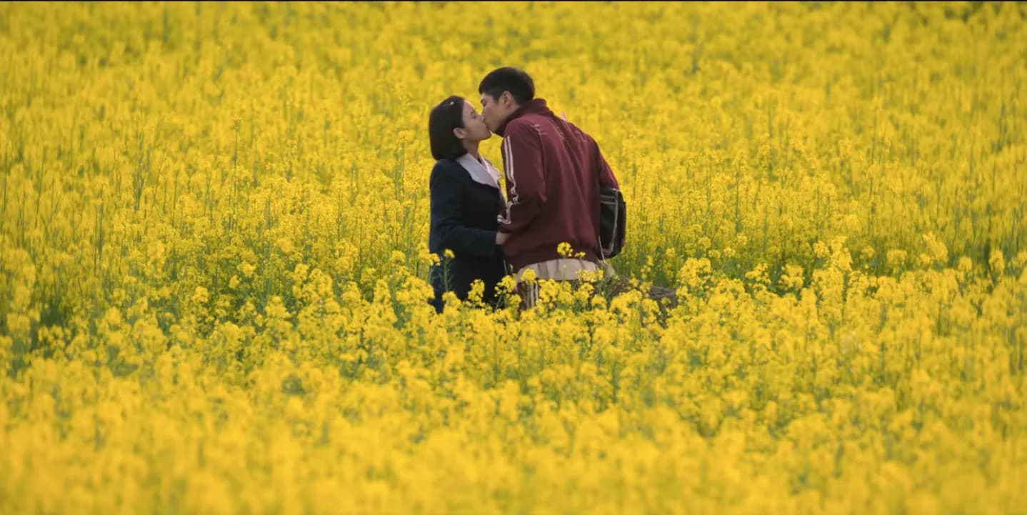 Ae-sun and Gwan-sik in the canola field — the show's signature first-kiss scene at Hagwon Farm
