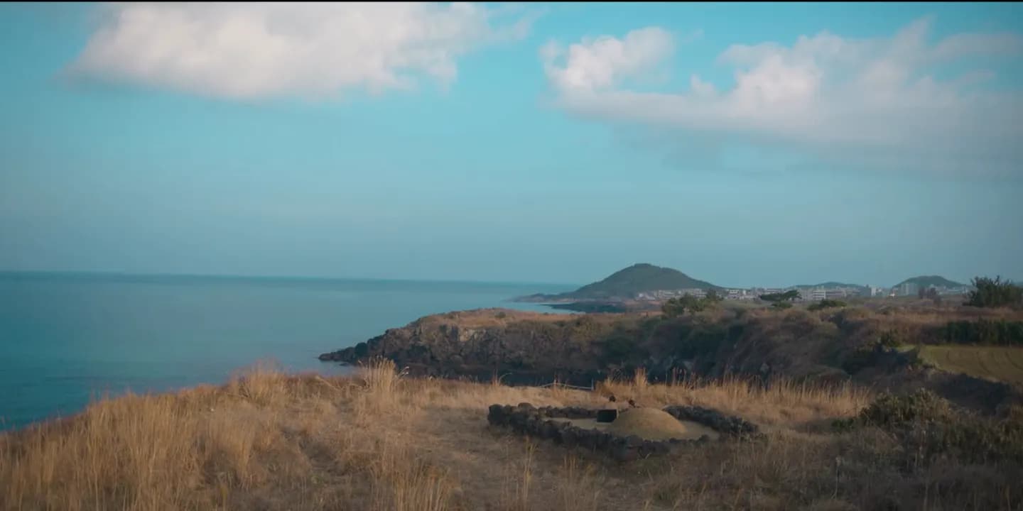 Saengigijeong cliff edge facing the ocean — the framing used in the Volume III conversation