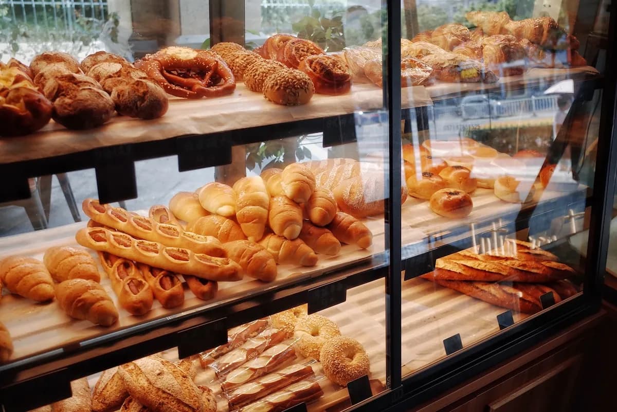 Display of freshly baked Korean breads in a traditional bakery