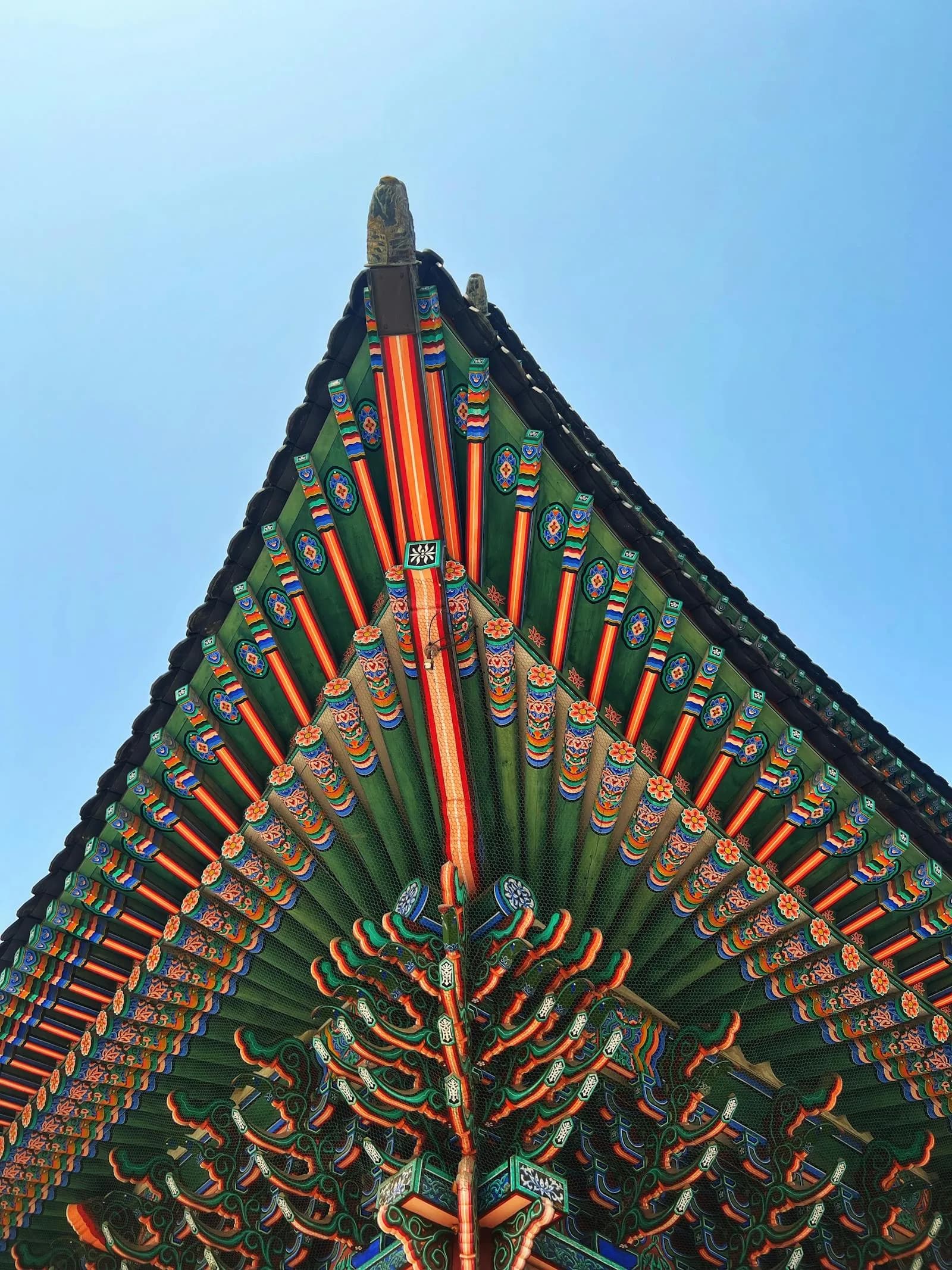 Close-up of colorful traditional Korean temple roof showing intricate dancheong architectural details