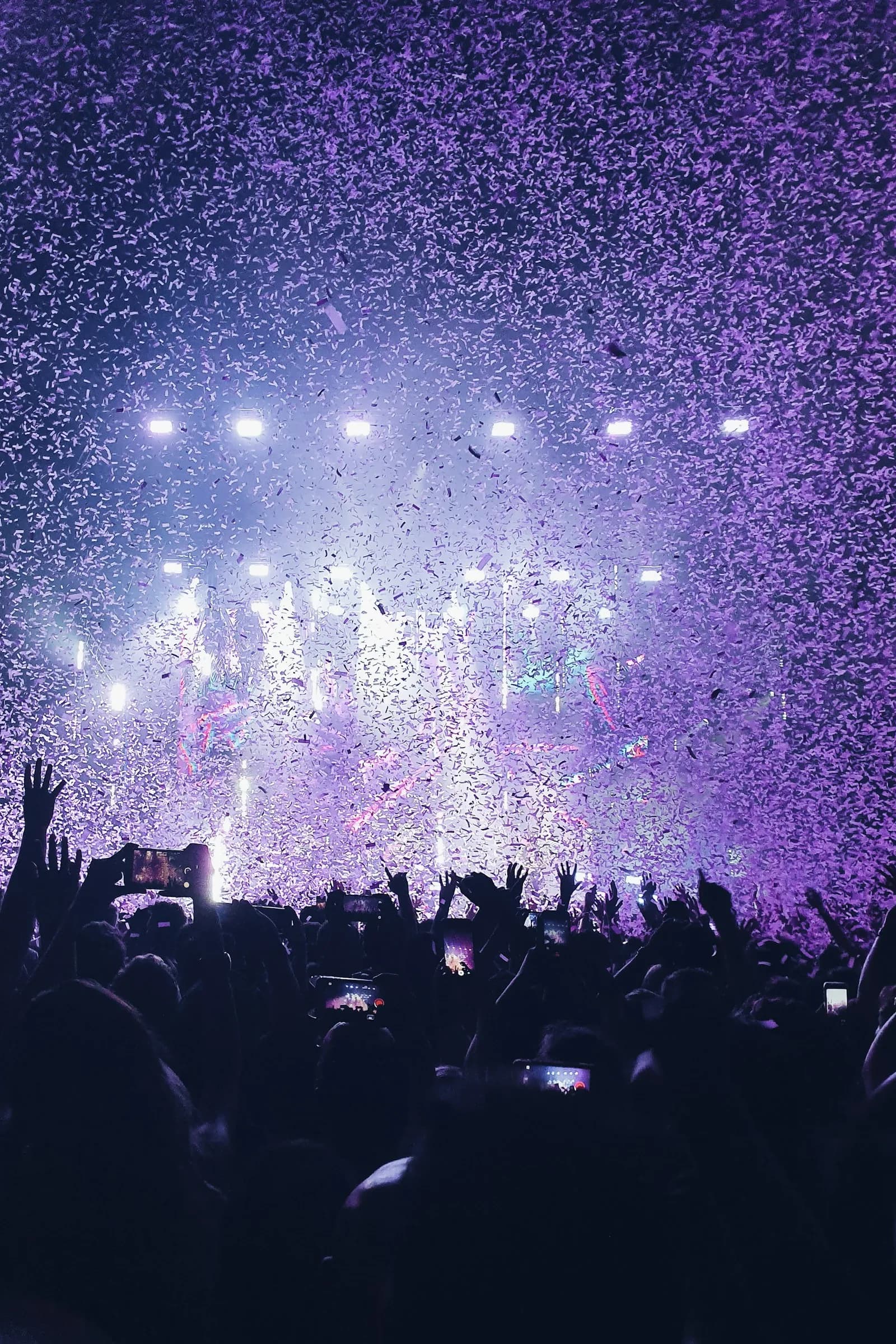 Vertical view of concert audience and stage at a K-pop venue