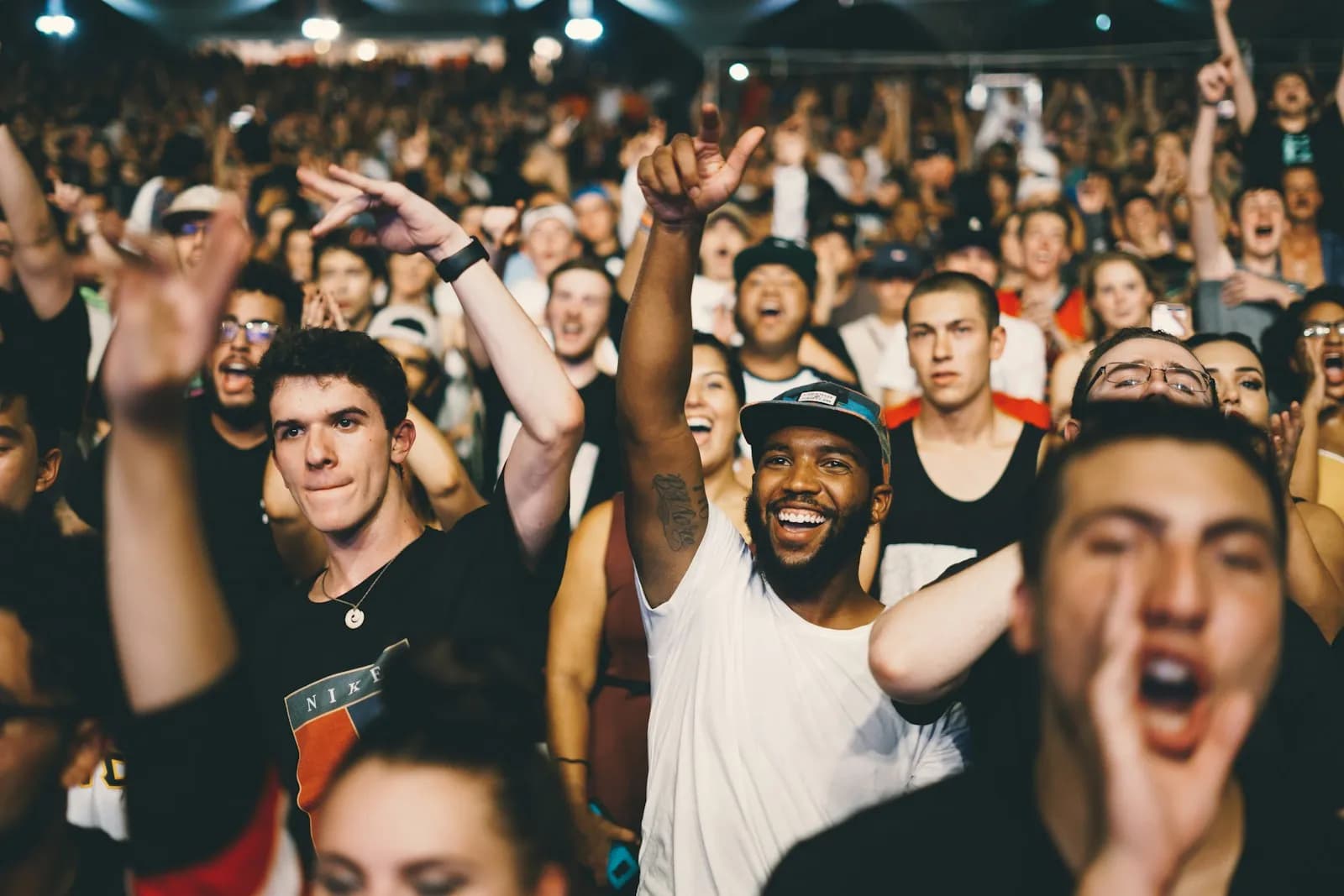 Wide shot of concert audience filing in for a show