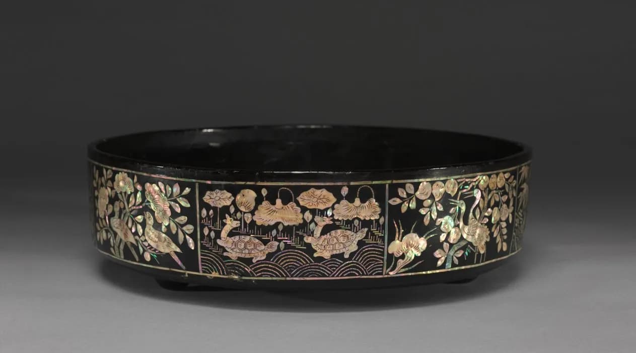Round lacquer tray inlaid with mother-of-pearl cranes, turtles, and lotus