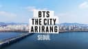BTS THE CITY ARIRANG SEOUL title card from the official BANGTANTV film, Seoul skyline over the Han River
