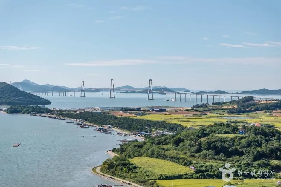 Cheonsa Bridge beyond the rice fields and shore of Sinan