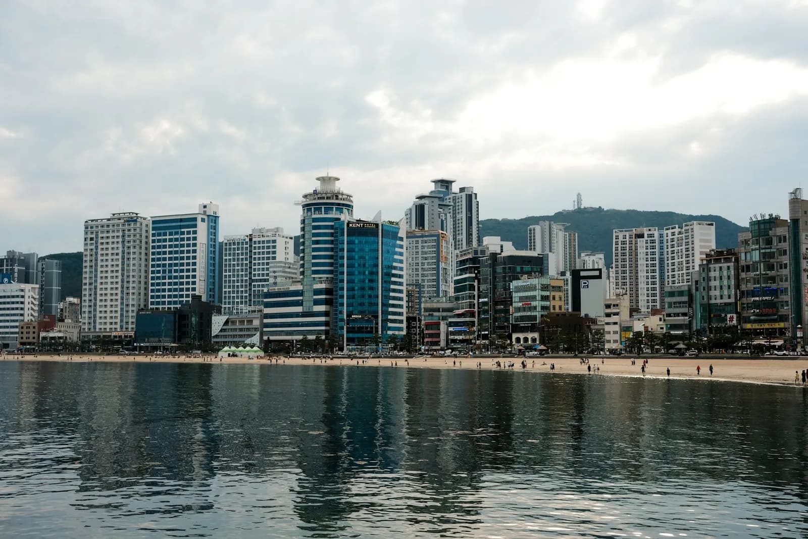 Gwangalli Beach with Gwangan Bridge and Busan city skyline across the water