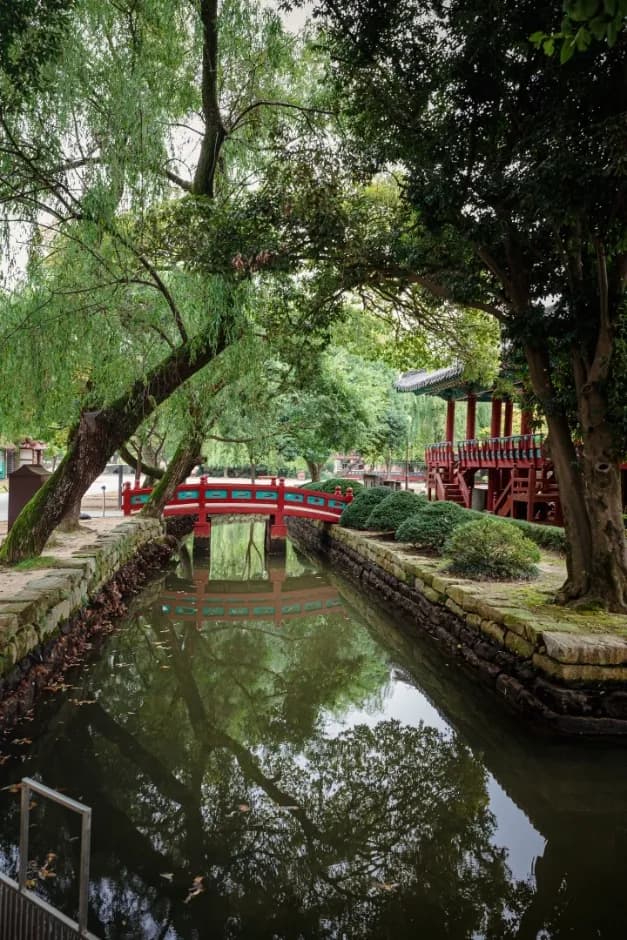 Traditional pavilion architecture and pond at Gwanghallu Garden in Namwon
