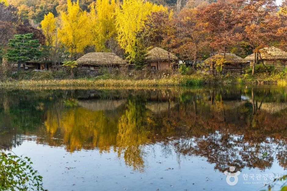 Traditional Joseon-era houses with thatched and tiled roofs at Korean Folk Village in Yongin