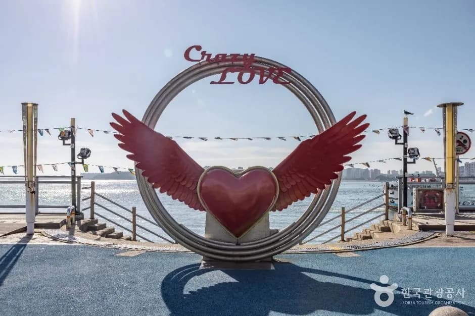 Crazy Love heart sculpture with ocean view on Wolmido waterfront