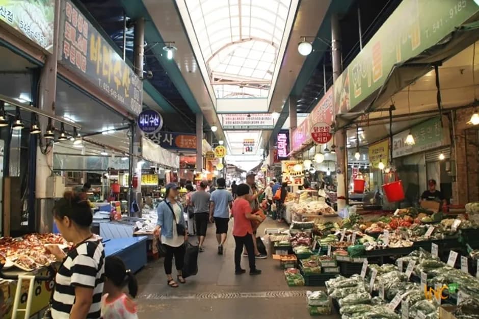 Shoppers along the bustling market lane