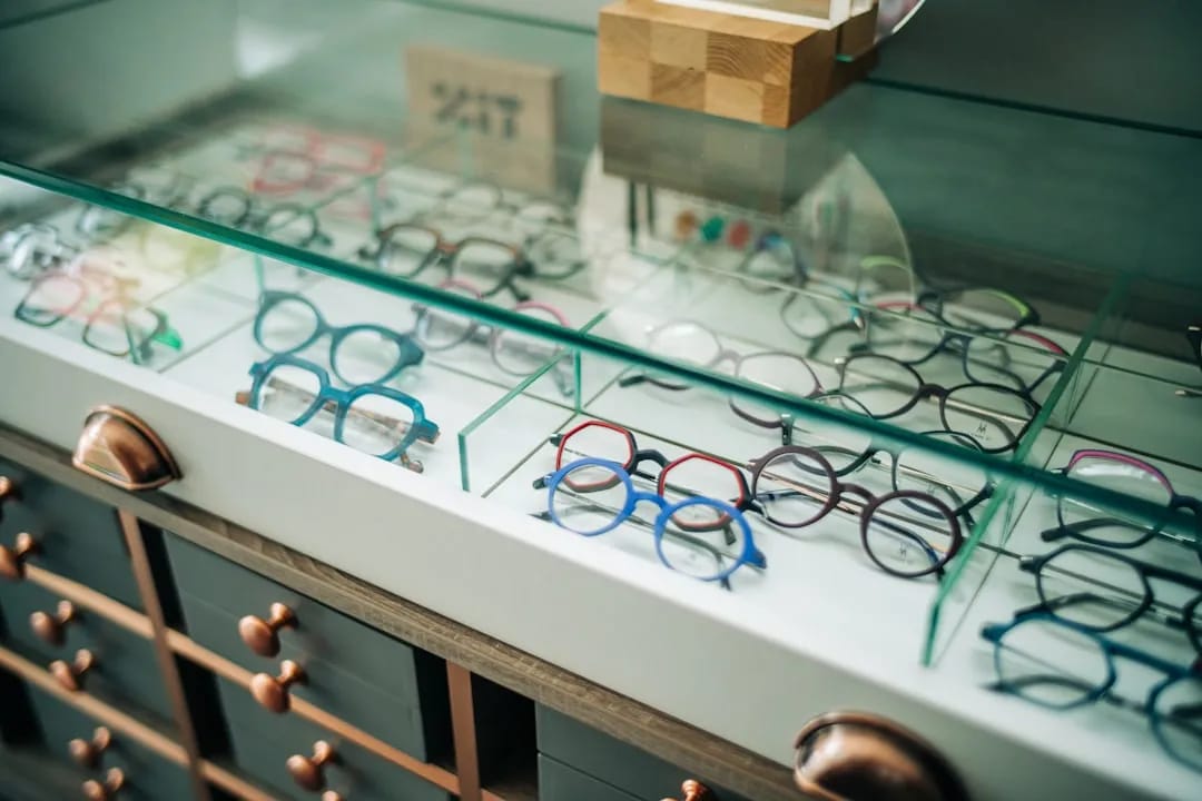 Rows of stylish glasses frames displayed in a Korean optical shop