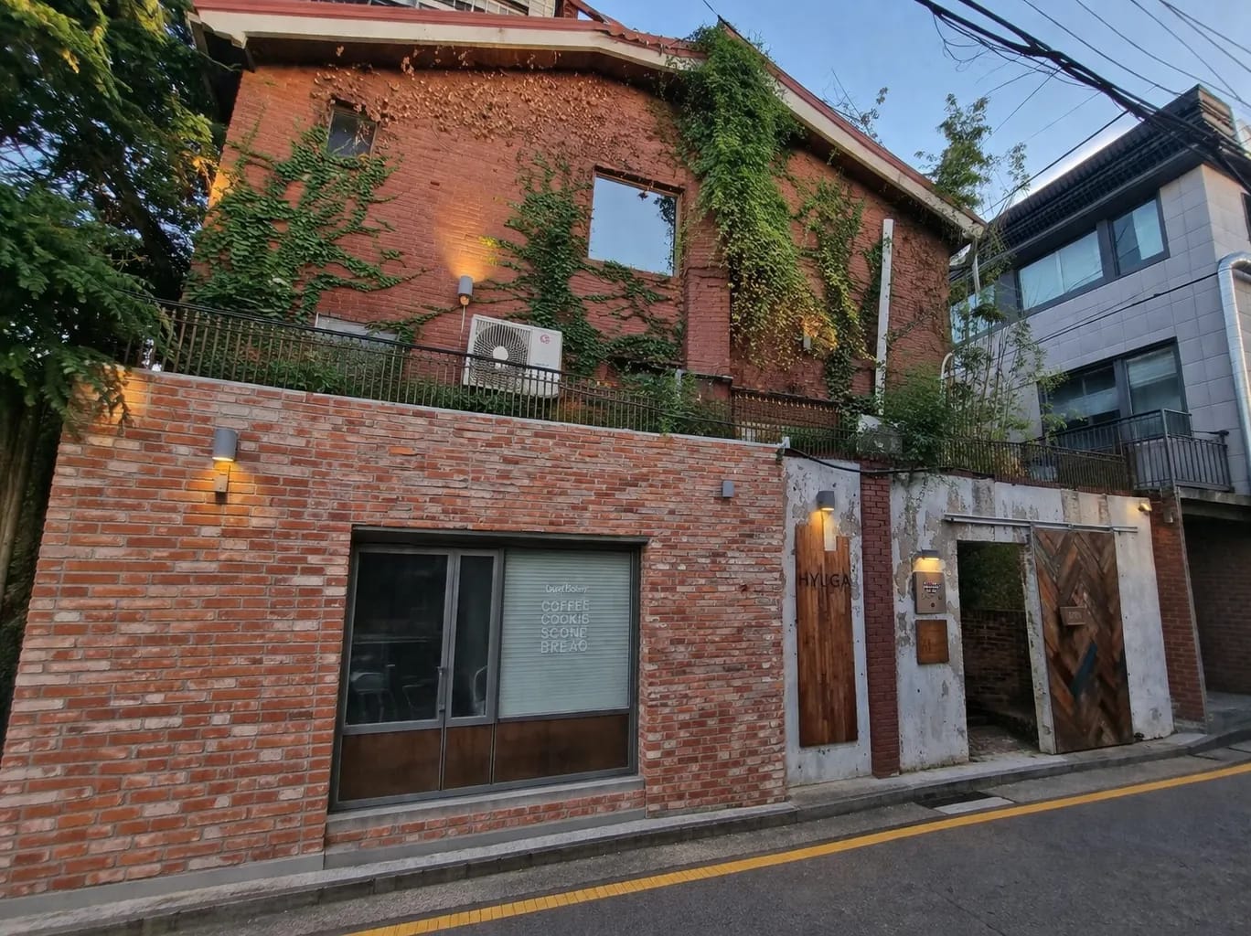 Cafe Hyuga exterior with red brick walls and ivy in Nonhyeon-dong, Gangnam