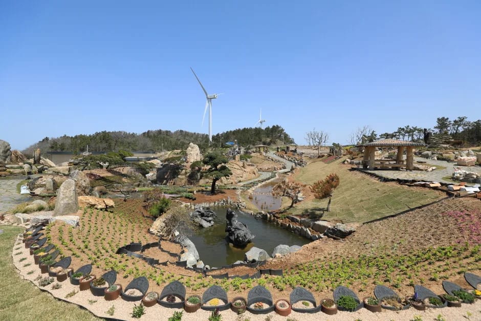 Bonsai garden with a central pond and wind turbines on Aphae-do, Sinan
