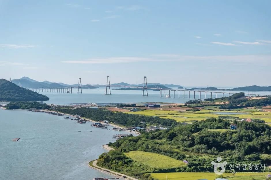 Cheonsa Bridge beyond the rice fields and shore of Sinan