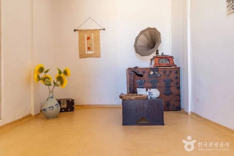 Period room with an old gramophone and chest inside Kim Whanki House, Sinan