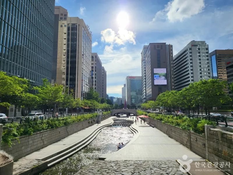 Cheonggyecheon Stream flowing through downtown Seoul with pedestrians
