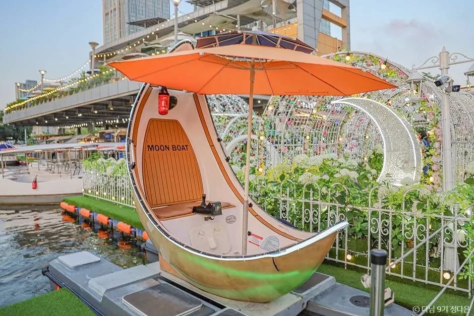 Moon Boat with orange canopy at Songdo Central Park boat house