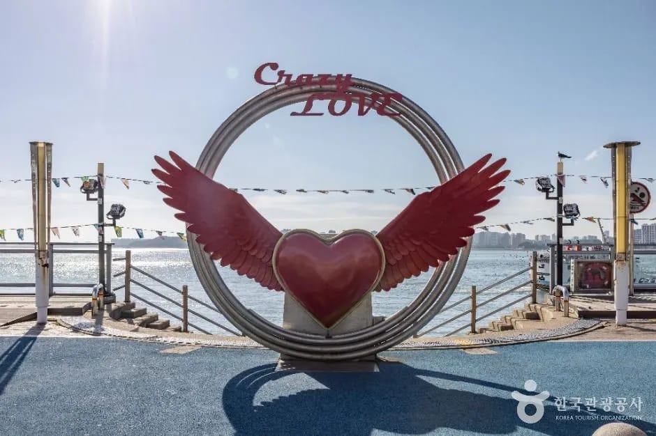 Crazy Love heart sculpture with ocean view on Wolmido waterfront