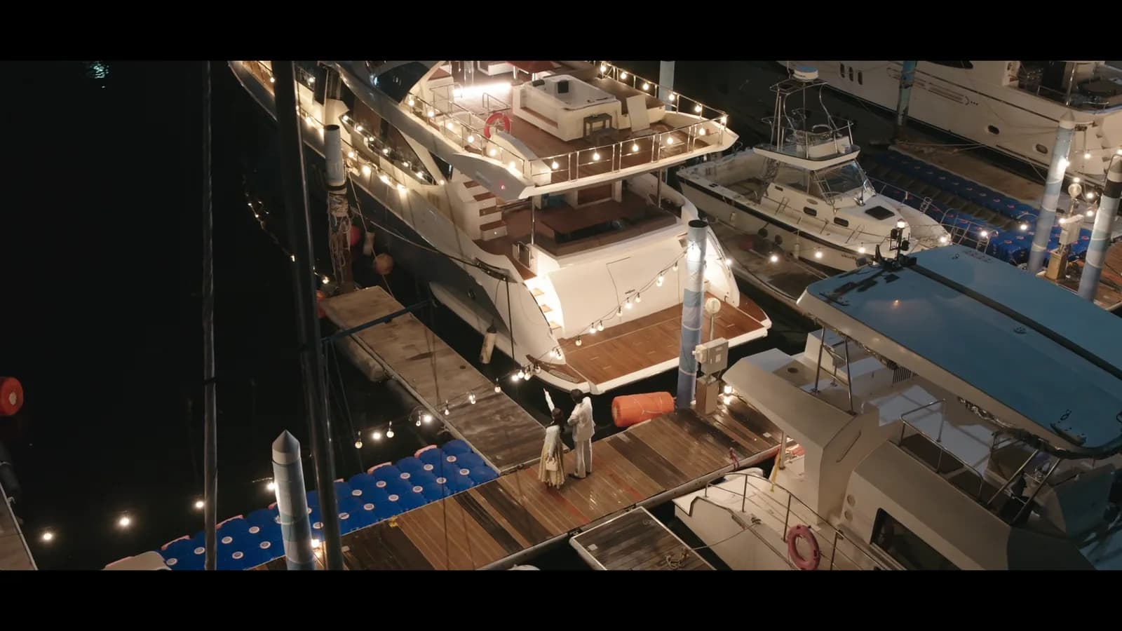 Hee-ju's yacht moored at The Bay 101 with Gwangan Bridge behind