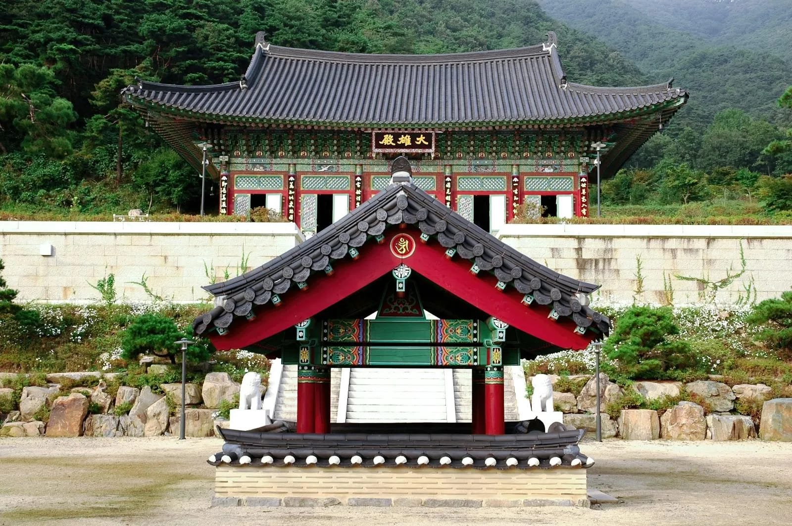 Traditional Korean Buddhist temple with stone pagoda in a mountain setting