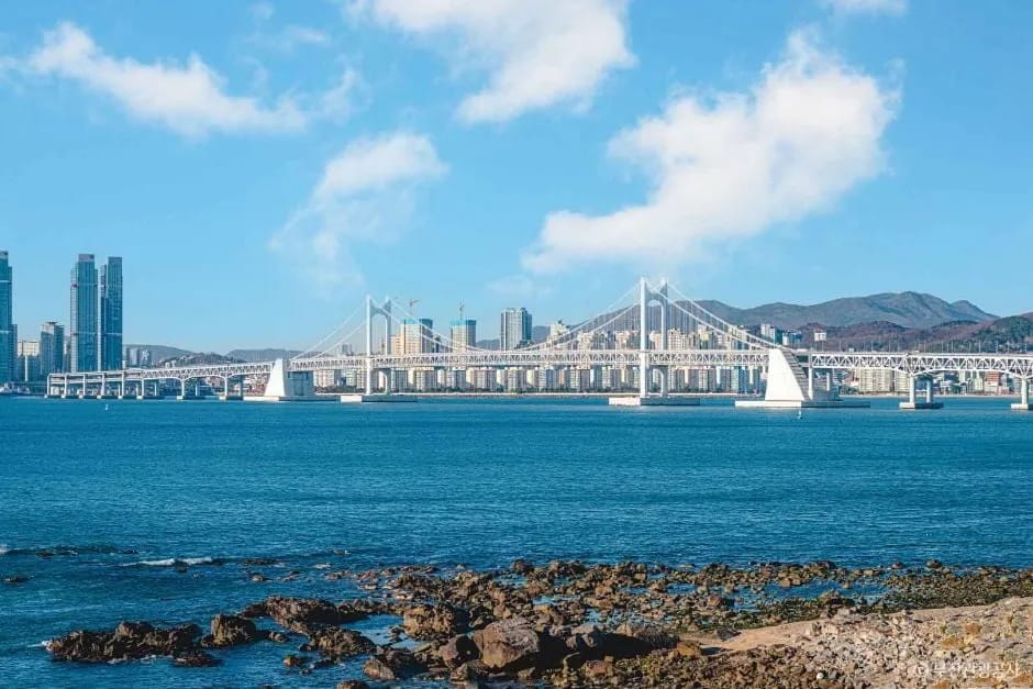 Busan coastline with blue ocean waves and sandy beach