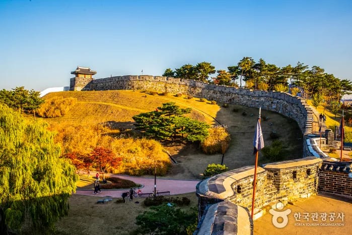 Suwon Hwaseong Fortress walls and watchtower with a clear sky